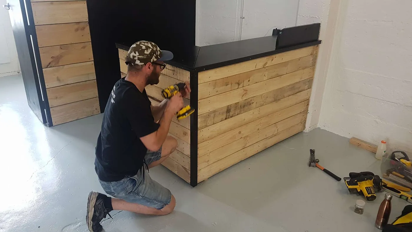 Dan fitting a timber-clad counter during a commercial fit-out